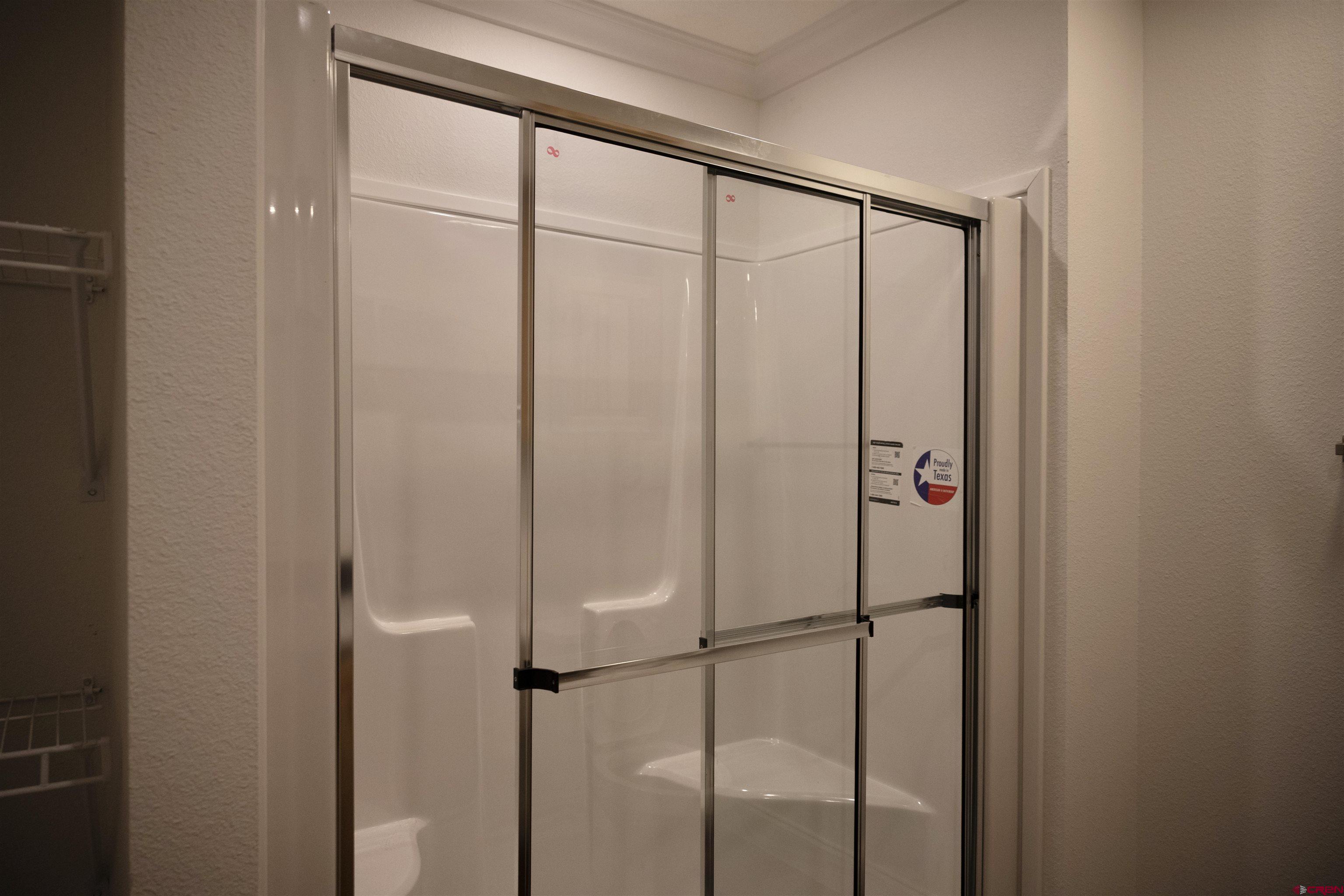 6000 County Road 203, Unit 44 Durango, CO 81301 - Photo 13 of 21 a bathroom with a glass shower door