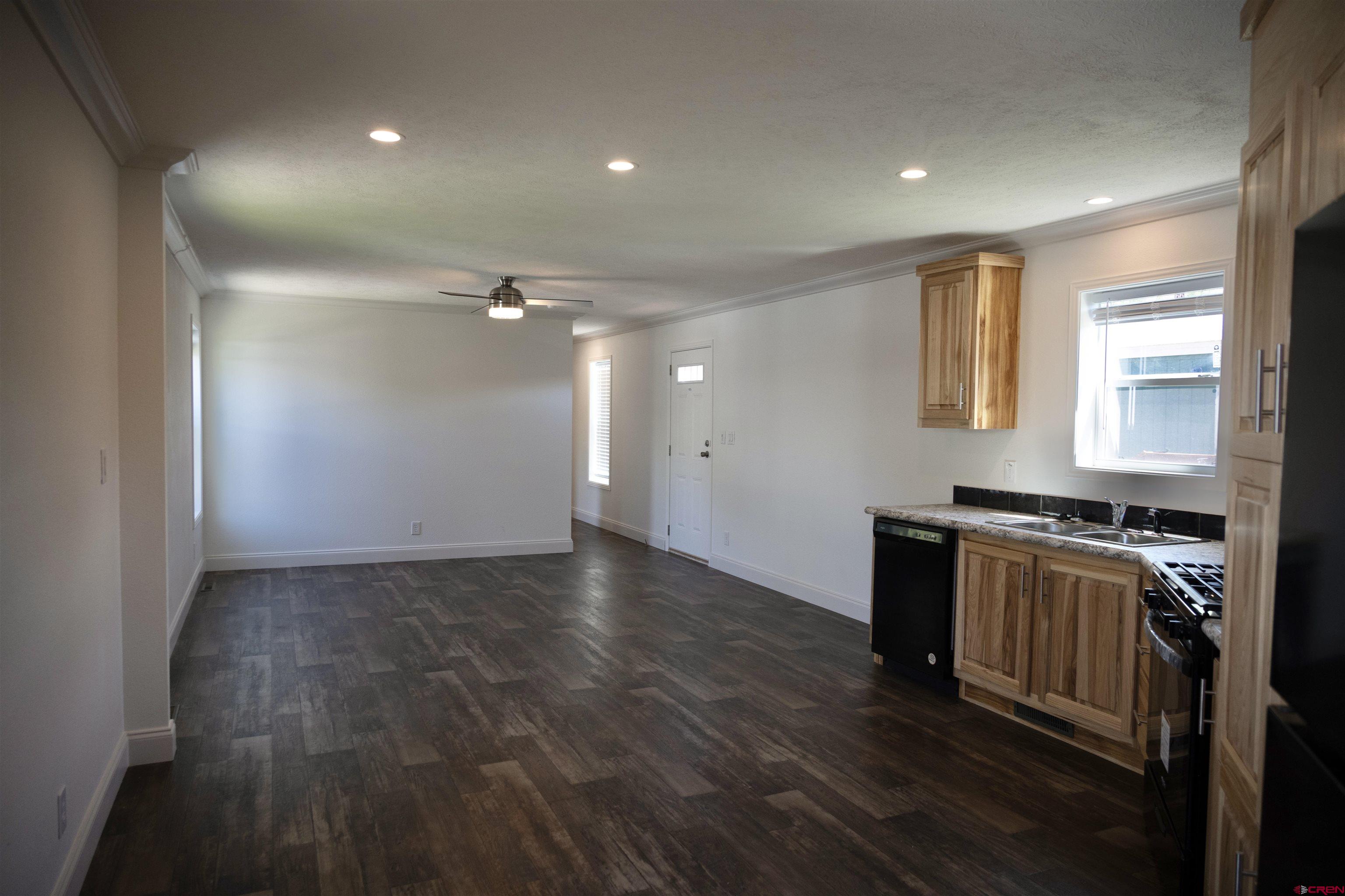 6000 County Road 203, Unit 44 Durango, CO 81301 - Photo 8 of 21 a kitchen with granite countertop a stove and a refrigerator