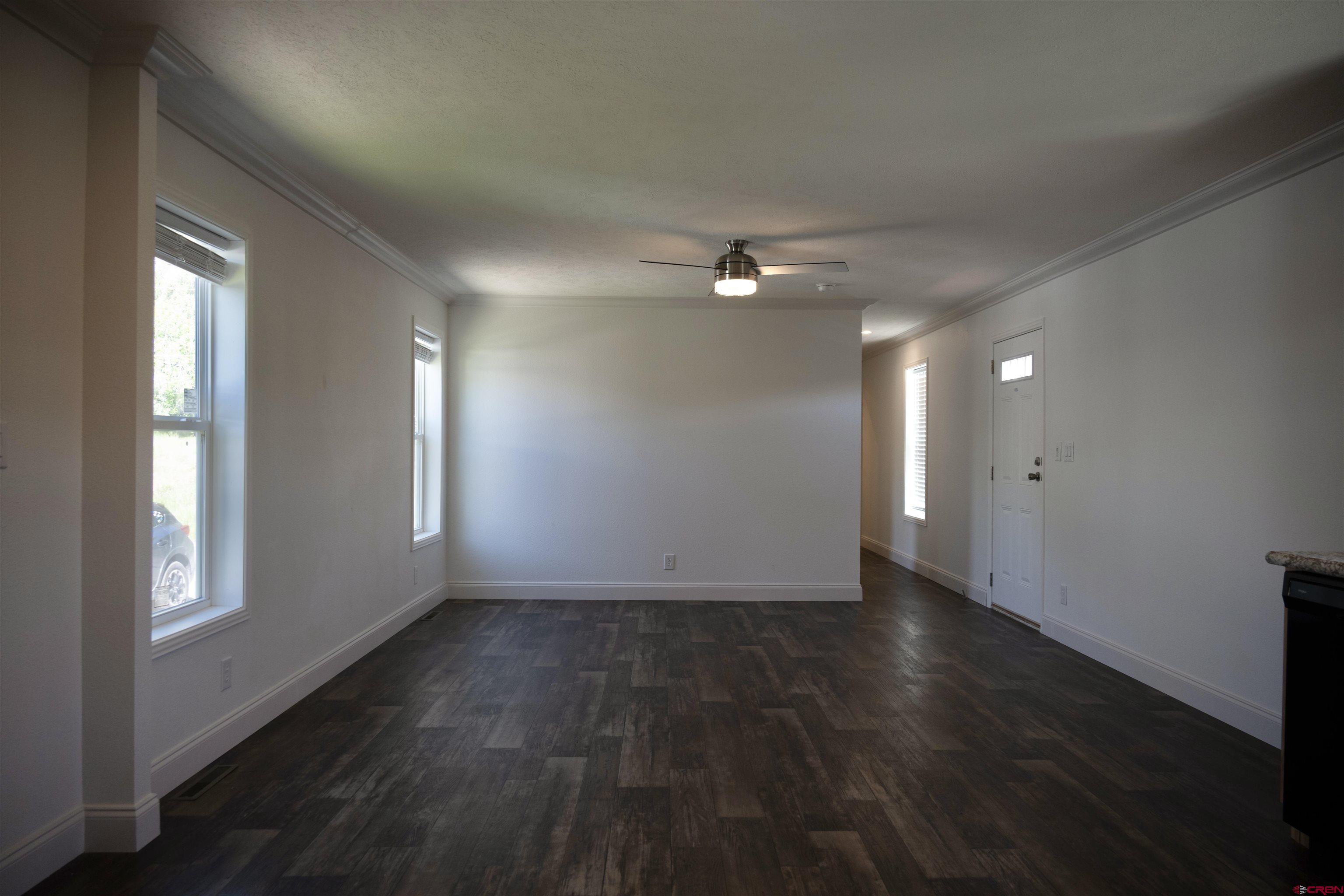 6000 County Road 203, Unit 44 Durango, CO 81301 - Photo 9 of 21 a view of an empty room with wooden floor and a window