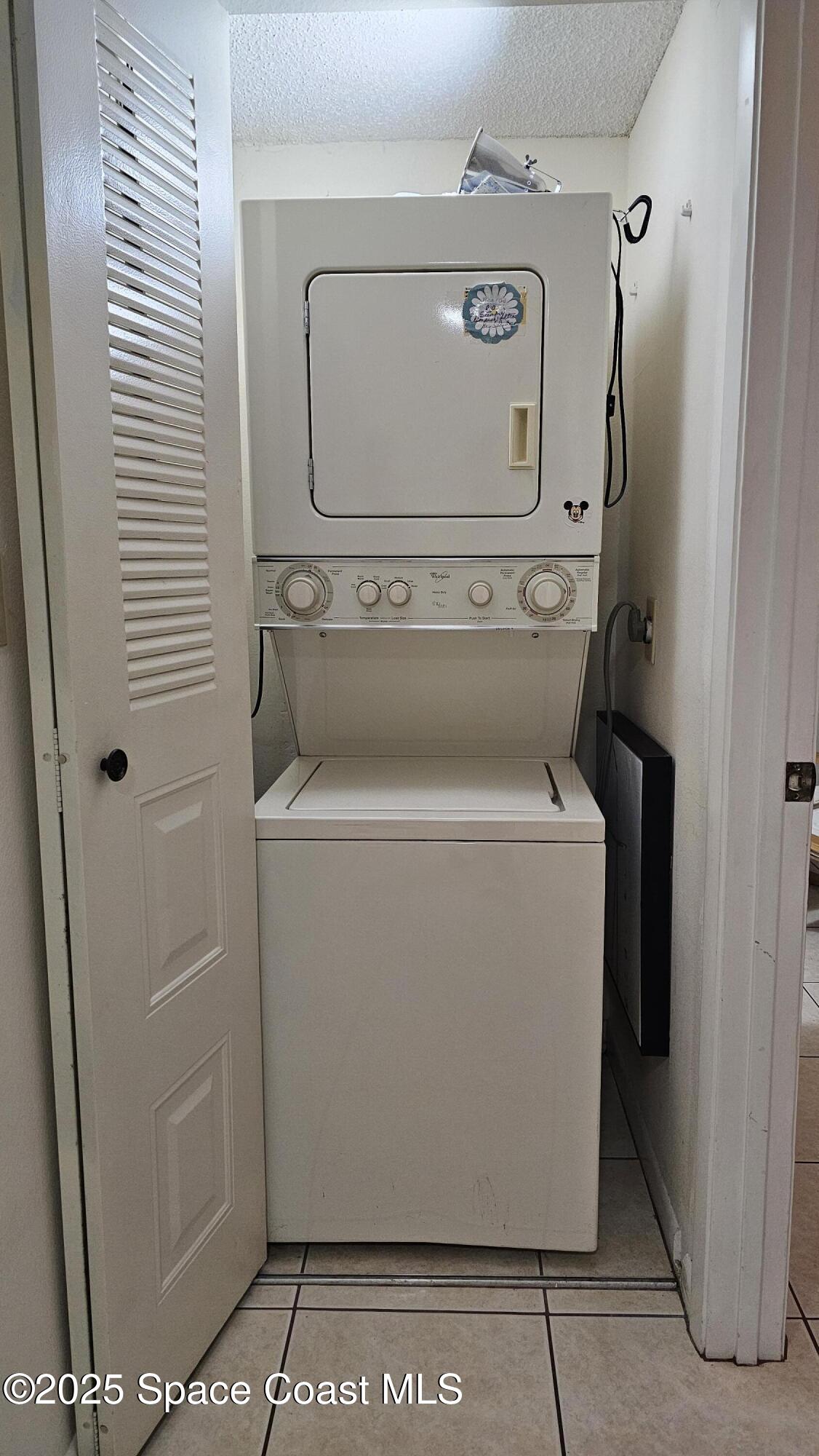 1641 Sunny Brook Lane, Unit C201 Palm Bay, FL 32905 - Photo 14 of 19 a utility room with dryer and washer