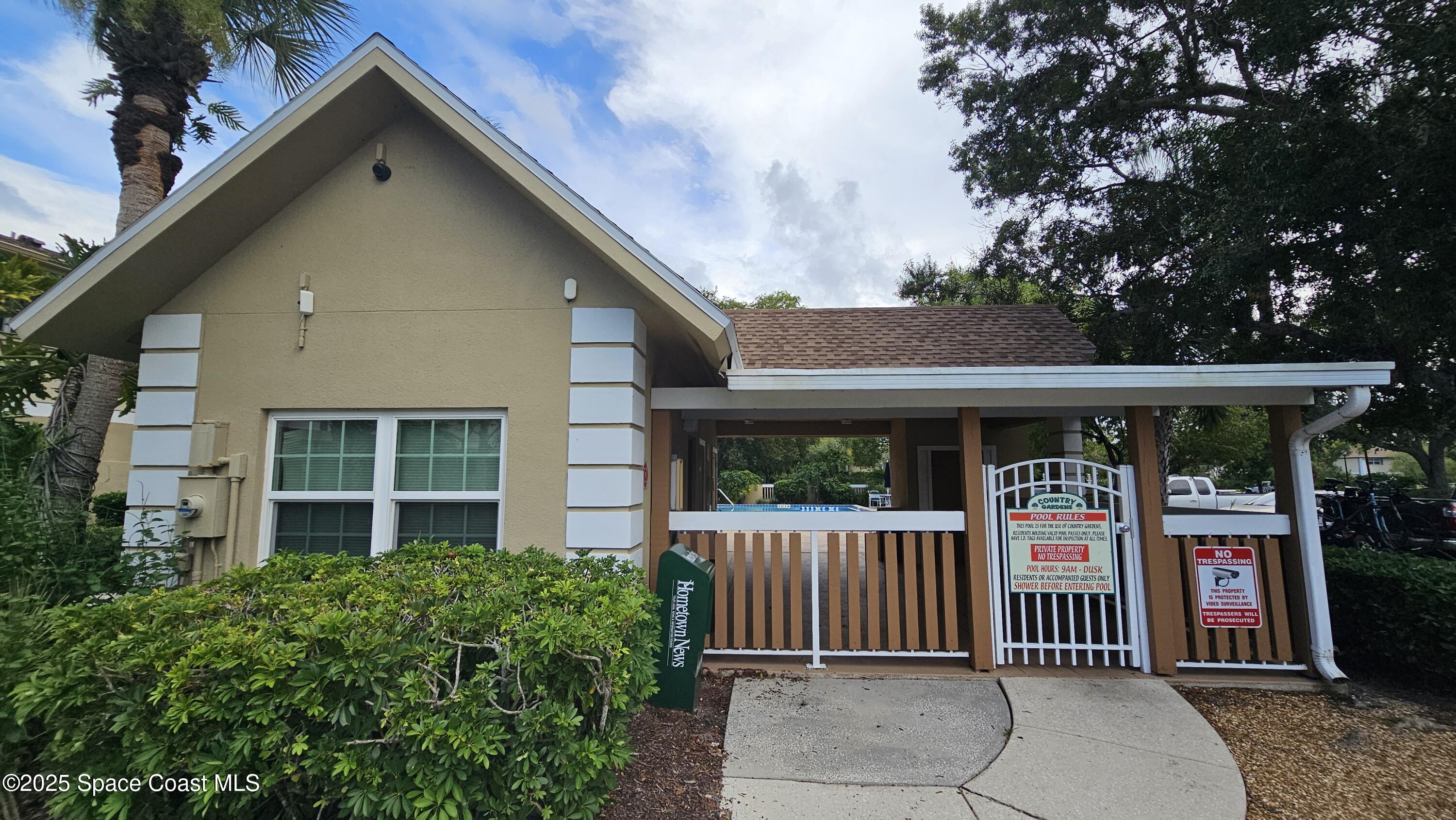1641 Sunny Brook Lane, Unit C201 Palm Bay, FL 32905 - Photo 15 of 19 a front view of a house with a porch