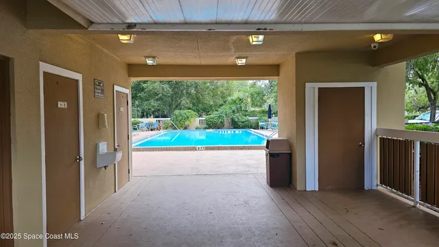 a view of livingroom with furniture and floor to ceiling window