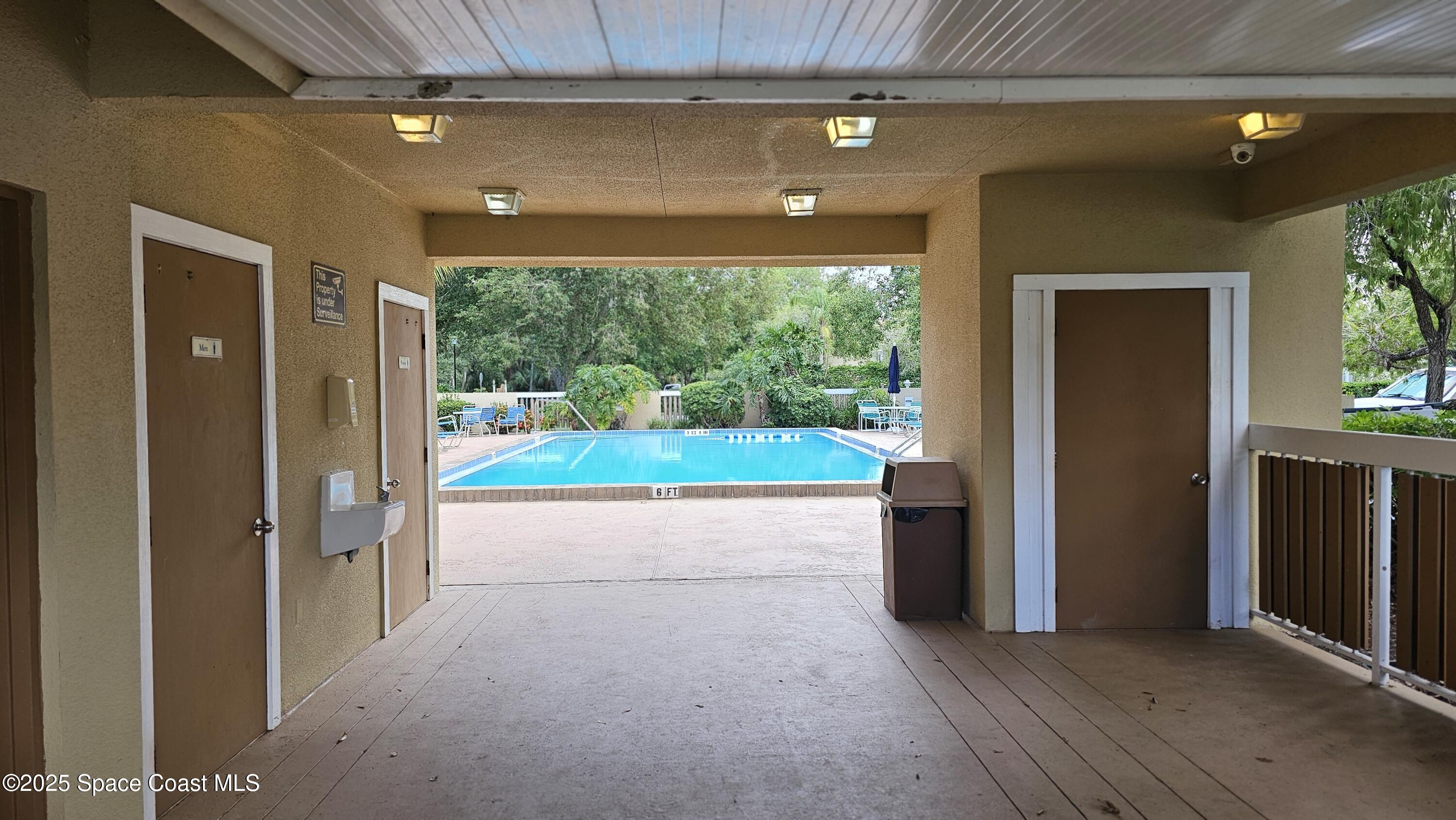 1641 Sunny Brook Lane, Unit C201 Palm Bay, FL 32905 - Photo 16 of 19 a view of livingroom with furniture and floor to ceiling window