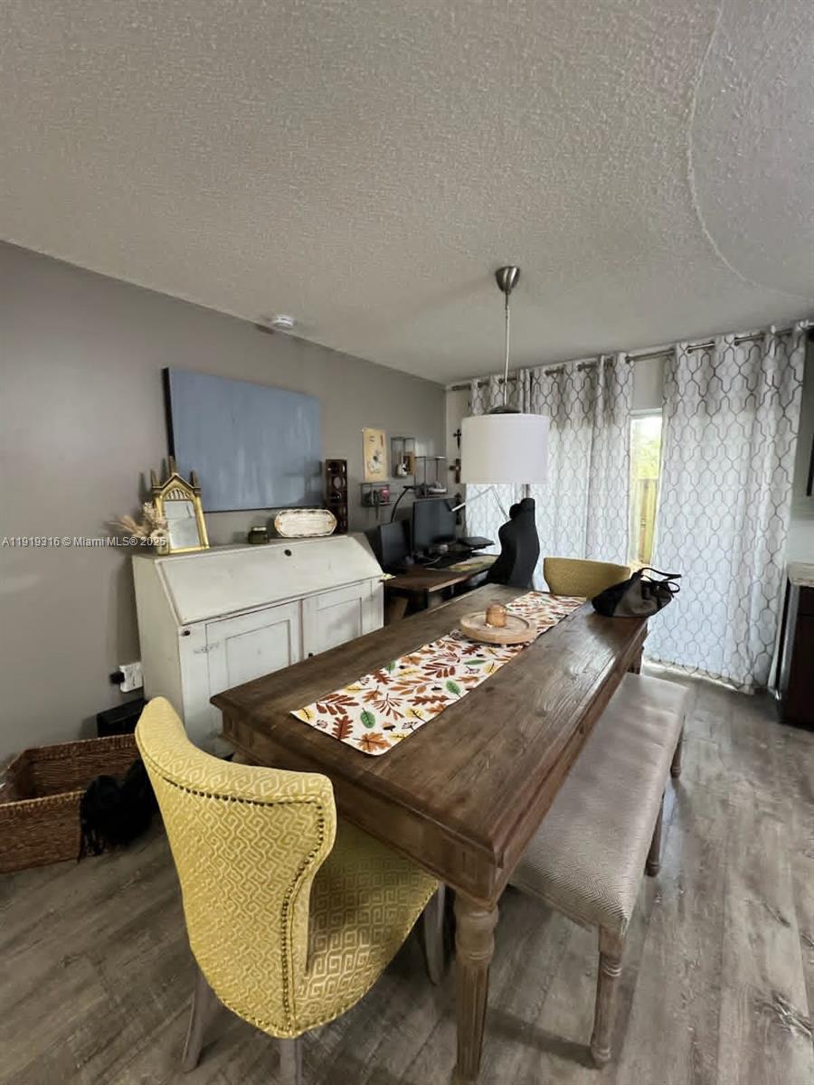8423 Southwest 137th Avenue, Unit 8423 Miami, FL 33183 - Photo 2 of 3 a living room with furniture