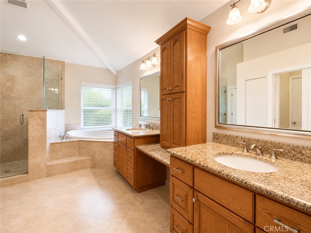 2811 North Roxbury Street Orange, CA 92867 - Photo 11 of 22 a spacious bathroom with a granite countertop tub sink and mirror