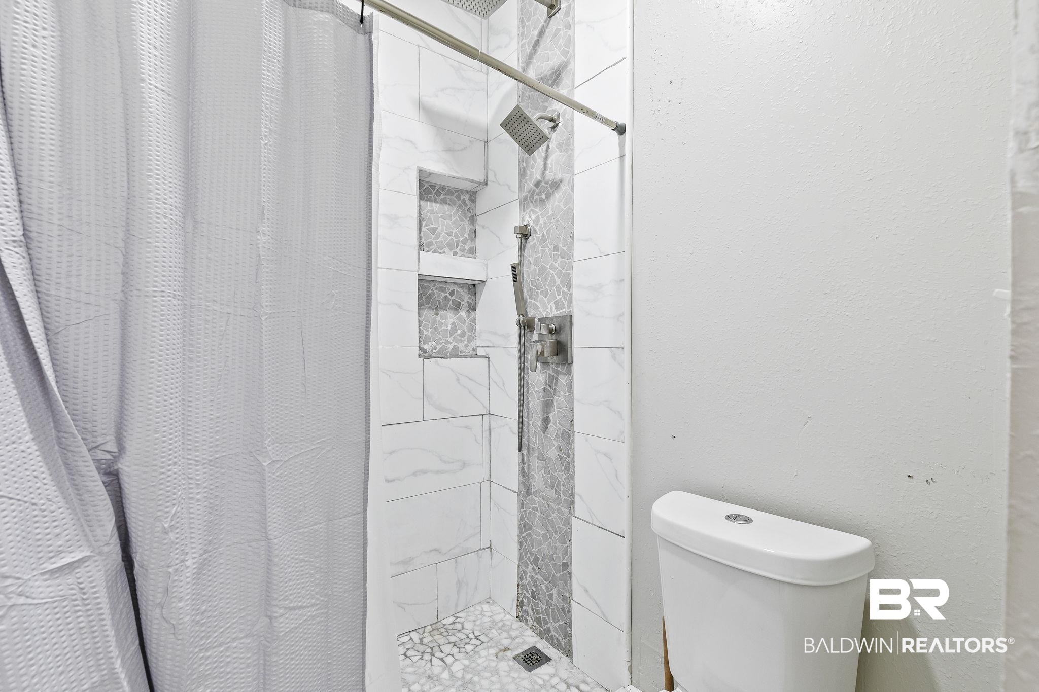 474 Ridgewood Drive Daphne, AL 36526 - Photo 34 of 57 Bathroom with toilet and walk in shower