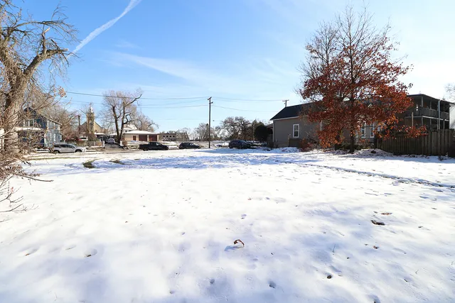 a view of a road with a building in the background