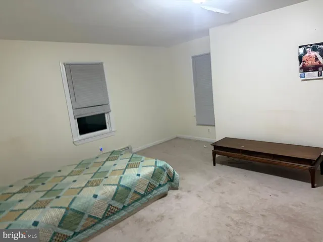 a bedroom with a bed and a cabinets