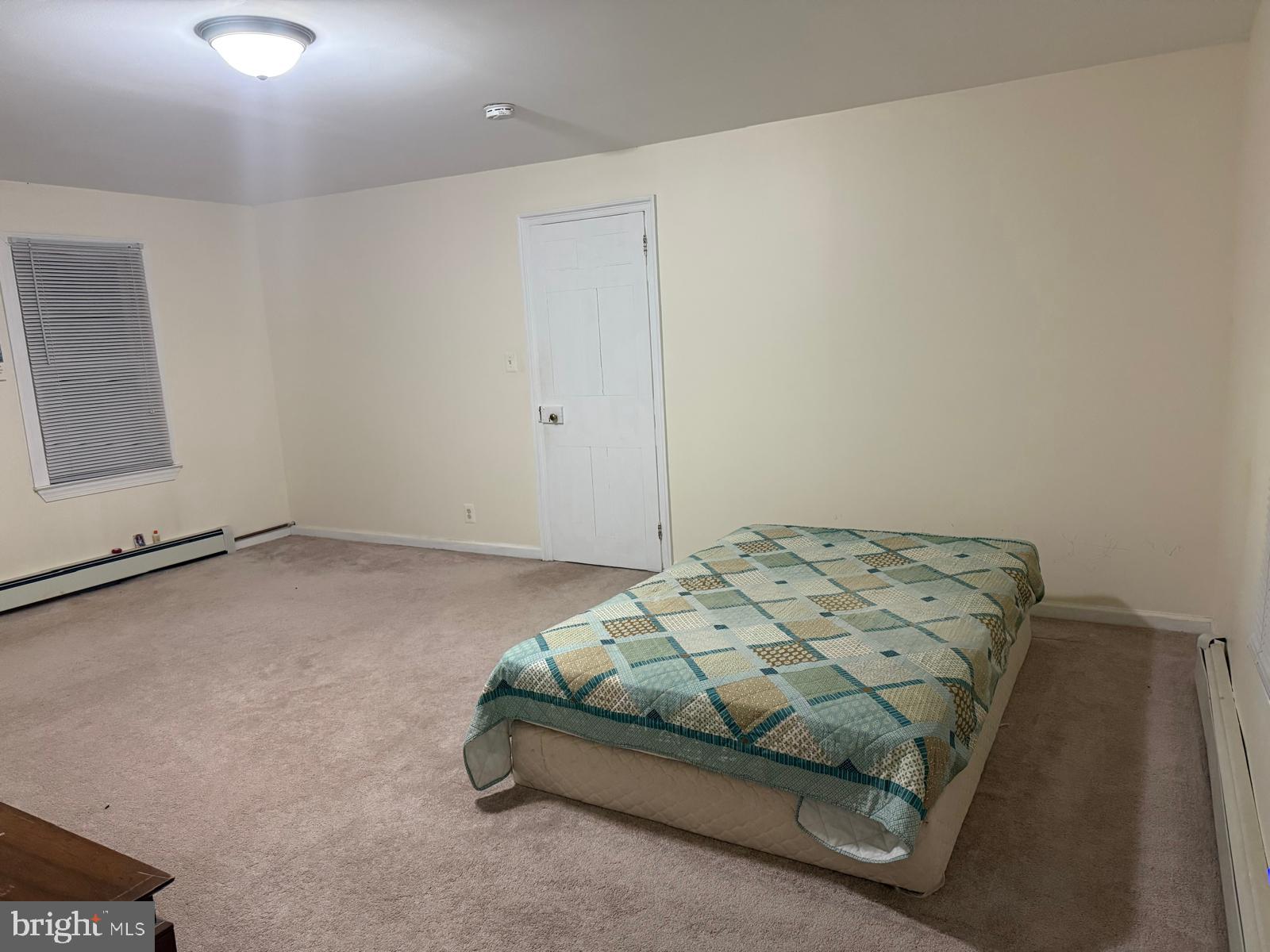 333 Etra Road Hightstown, NJ 08520 - Photo 12 of 16 a bedroom with a bed and window
