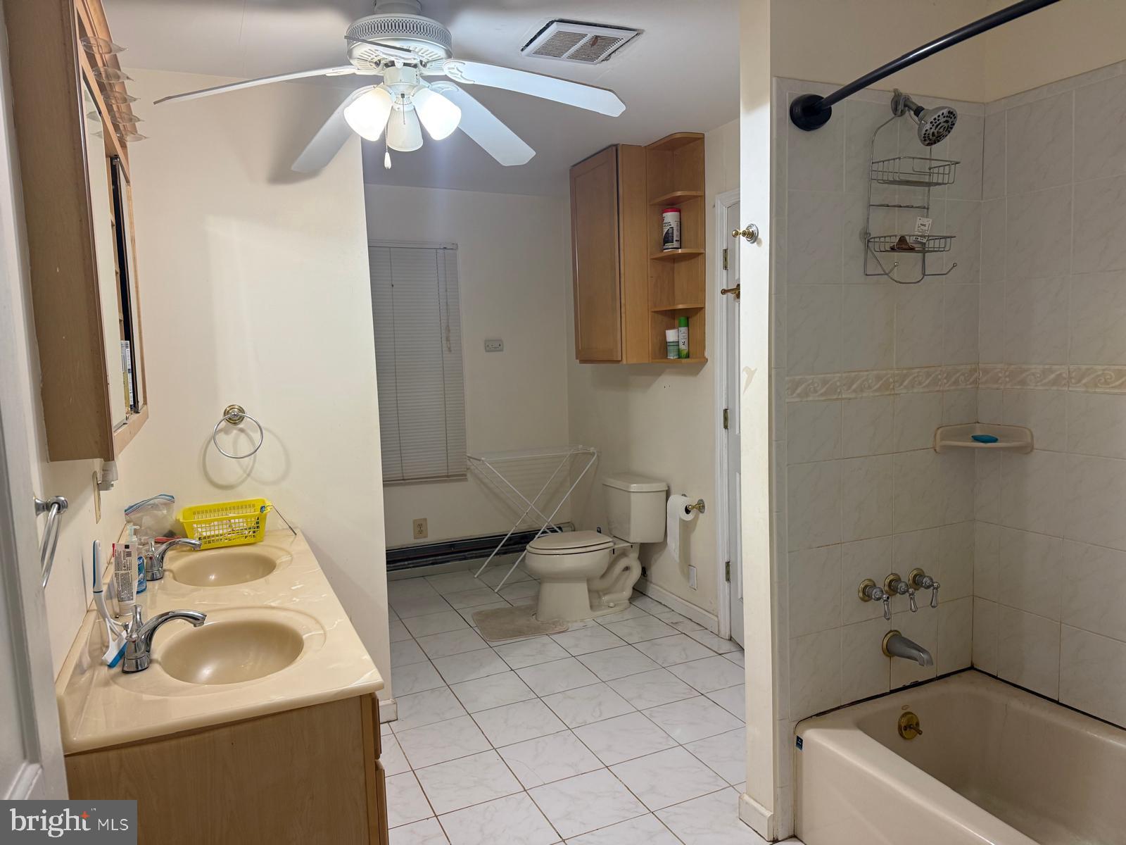 333 Etra Road Hightstown, NJ 08520 - Photo 14 of 16 a bathroom with a sink toilet and shower