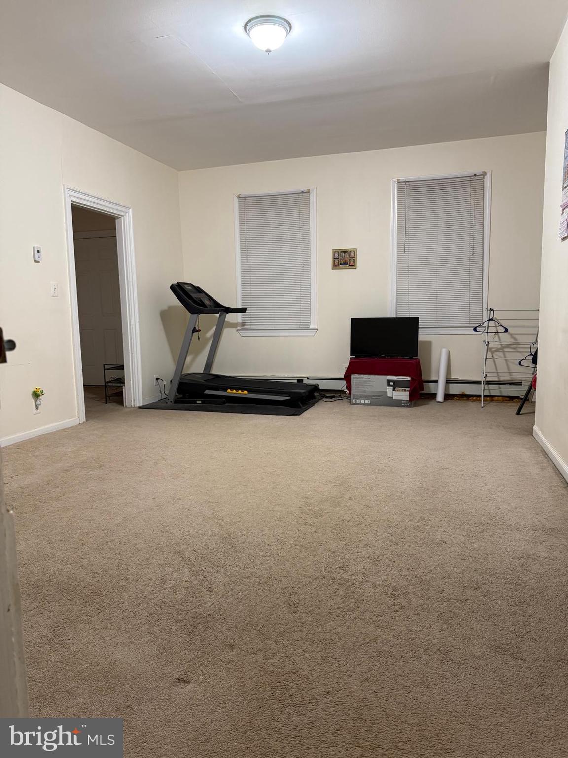 333 Etra Road Hightstown, NJ 08520 - Photo 15 of 16 a living room with furniture and a flat screen tv
