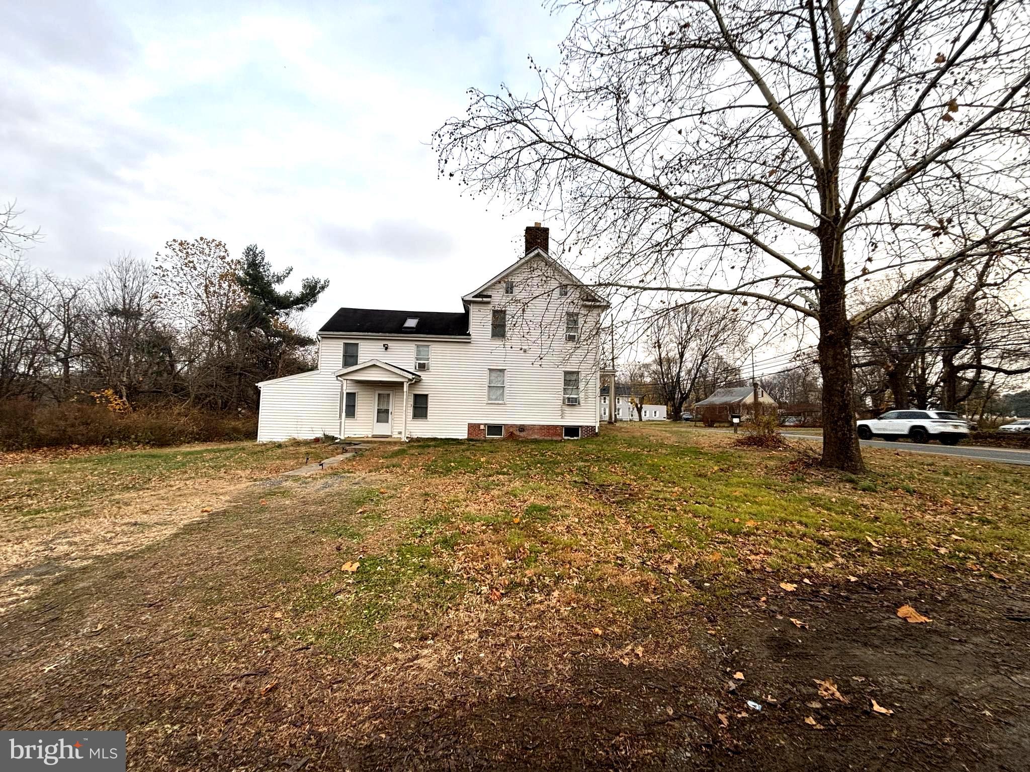 333 Etra Road Hightstown, NJ 08520 - Photo 2 of 16 a white house that has a tree in front of it