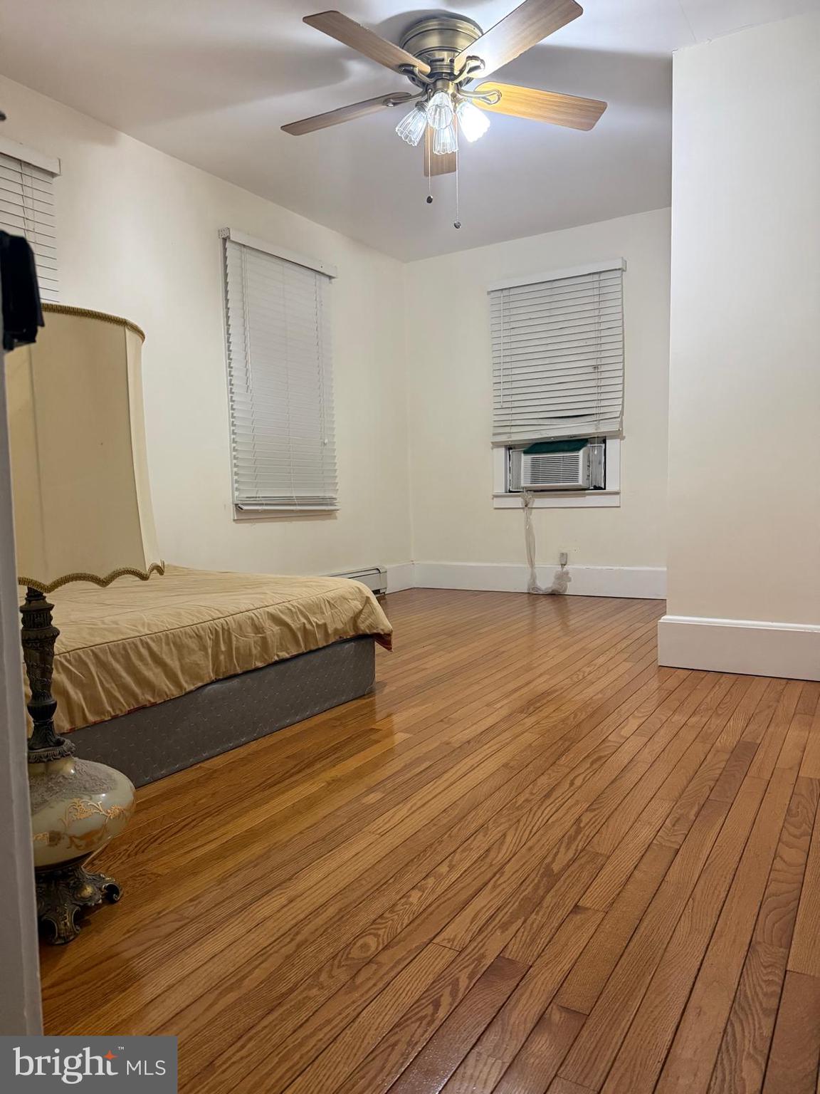 333 Etra Road Hightstown, NJ 08520 - Photo 9 of 16 a bedroom with a bed and a chandelier