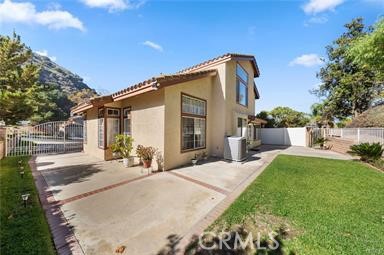 1611 San Almada Road Corona, CA 92882 - Photo 8 of 9 a front view of a house with yard outdoor seating and green space