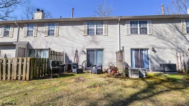 a kitchen with lots of counter top space and furniture