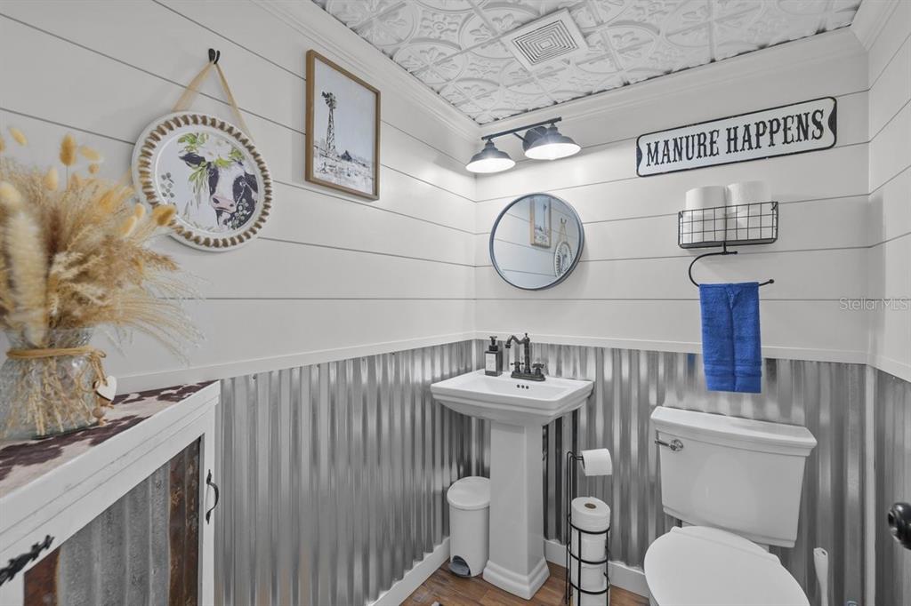 240 Whirlwind Loop Hawthorne, FL 32640 - Photo 13 of 39 a bathroom with a toilet and a sink