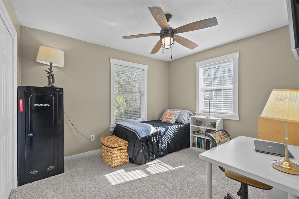 240 Whirlwind Loop Hawthorne, FL 32640 - Photo 17 of 39 a living room with furniture and a window