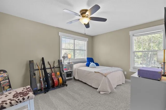 a bed room with a bed and a window