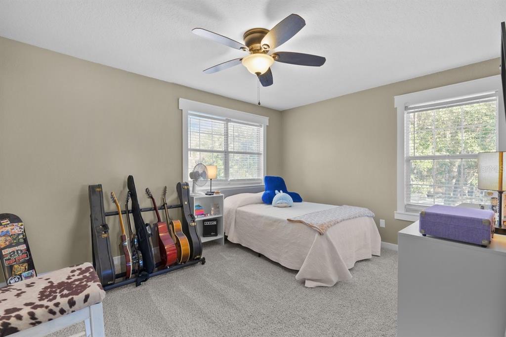 240 Whirlwind Loop Hawthorne, FL 32640 - Photo 19 of 39 a bed room with a bed and a window