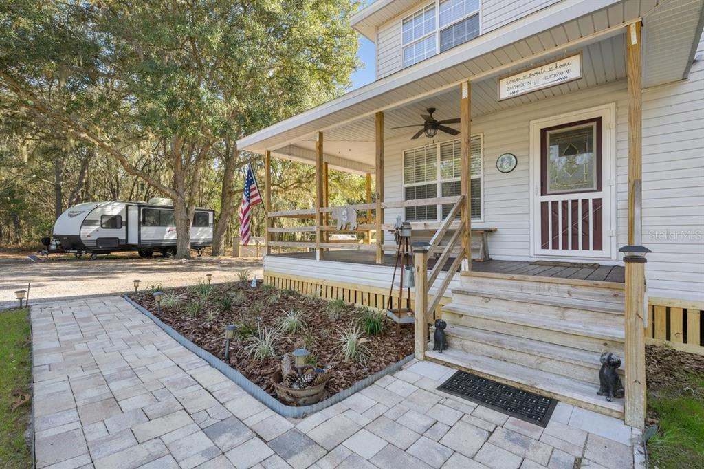 240 Whirlwind Loop Hawthorne, FL 32640 - Photo 2 of 39 a front view of a house with a yard