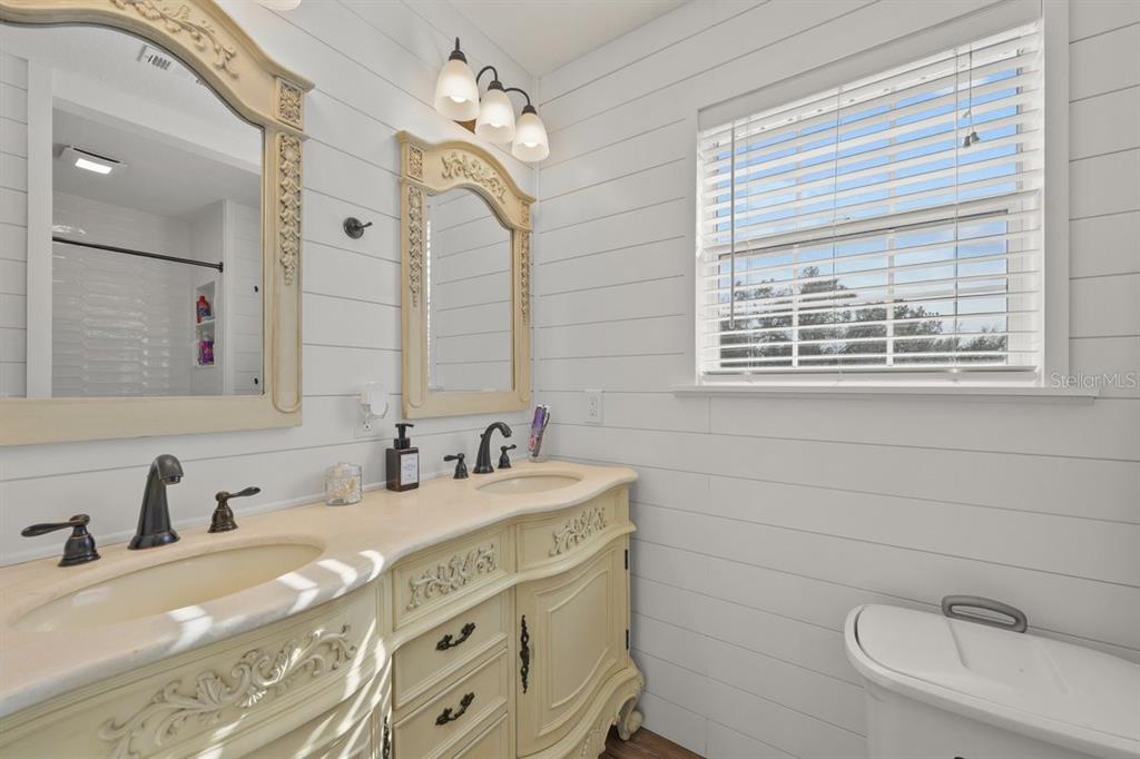 240 Whirlwind Loop Hawthorne, FL 32640 - Photo 23 of 39 a bathroom with double vanity sink and a mirror