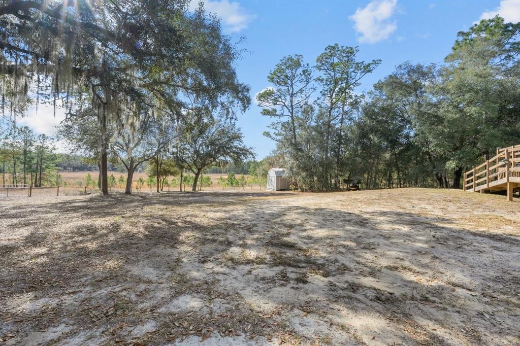 240 Whirlwind Loop Hawthorne, FL 32640 - Photo 27 of 39 a view of outdoor space with trees
