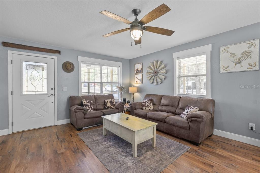 240 Whirlwind Loop Hawthorne, FL 32640 - Photo 3 of 39 a living room with furniture and a window