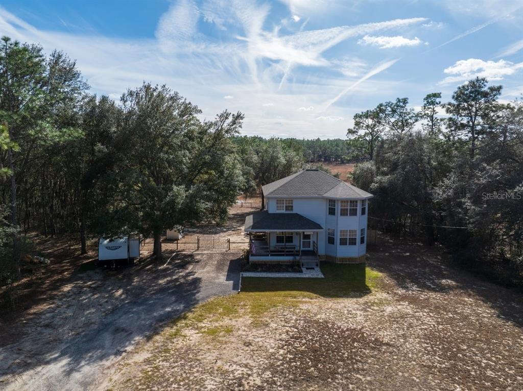 240 Whirlwind Loop Hawthorne, FL 32640 - Photo 36 of 39 a view of a house with a yard
