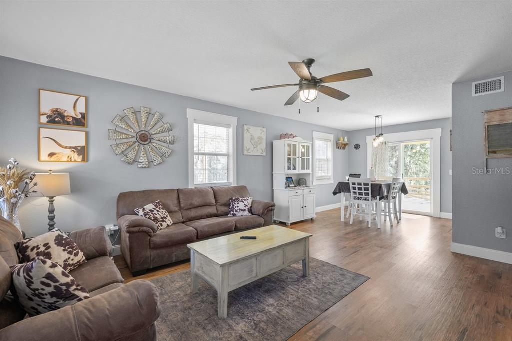 240 Whirlwind Loop Hawthorne, FL 32640 - Photo 4 of 39 a living room with furniture and wooden floor