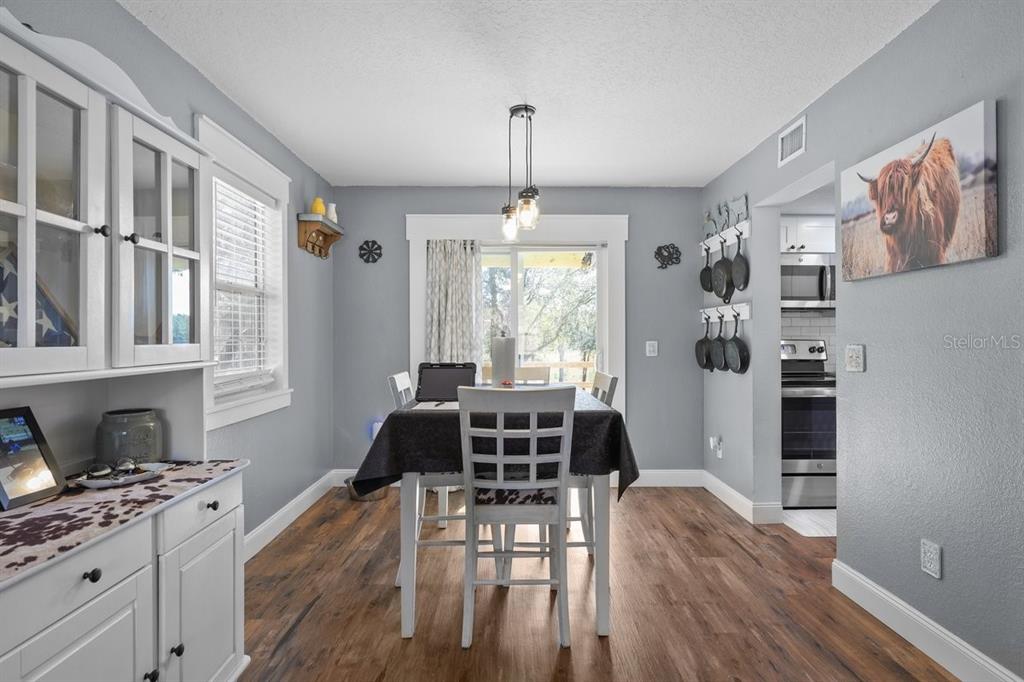 240 Whirlwind Loop Hawthorne, FL 32640 - Photo 6 of 39 a living room with furniture and a window
