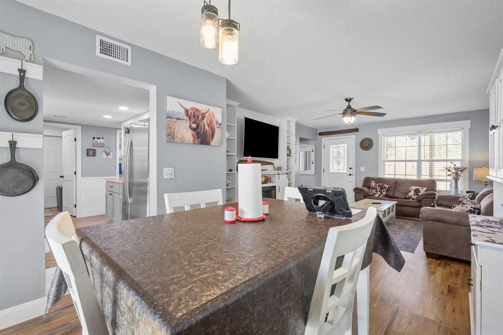 240 Whirlwind Loop Hawthorne, FL 32640 - Photo 7 of 39 a living room with furniture and a flat screen tv