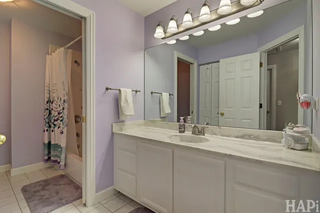 a bathroom with a sink double vanity and a mirror
