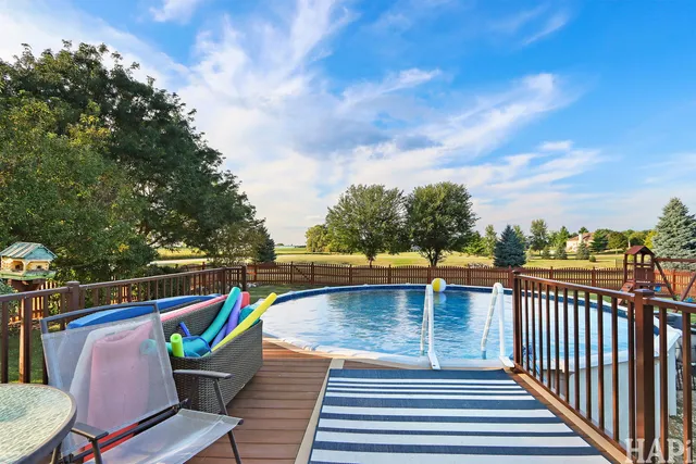a view of a chairs and table on the deck