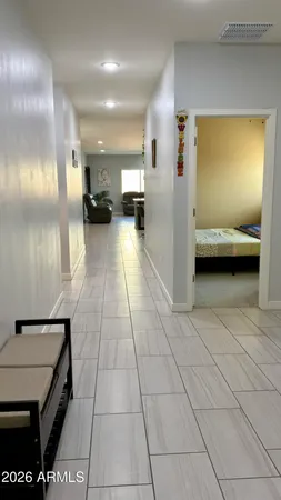 a view of kitchen with furniture and a refrigerator