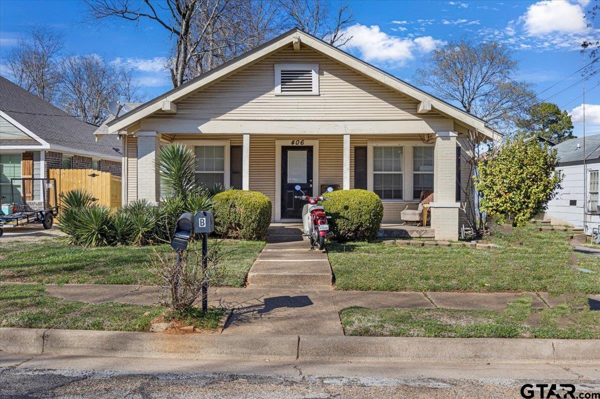406 East Reeves Street Tyler, TX 75702 - Photo 1 of 3 a front view of a house with garden