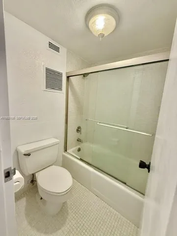 a view of a hallway with washer and dryer