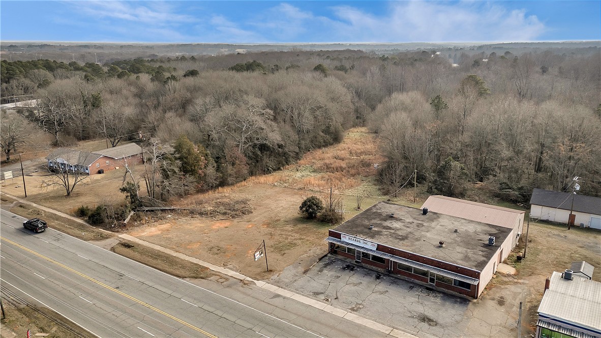 Tr A East Shockley Ferry Road Anderson, SC 29624 - Photo 3 of 10 Aerial view showcasing expansive land with development potential alongside existing structures and paved roads.
