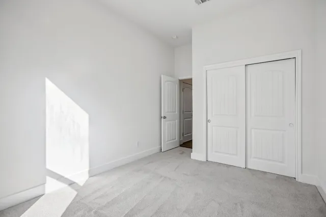 a bathroom with a bathtub shower sink vanity mirror and toilet