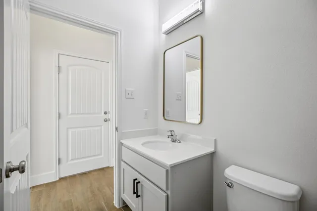 a view of an empty room with windows