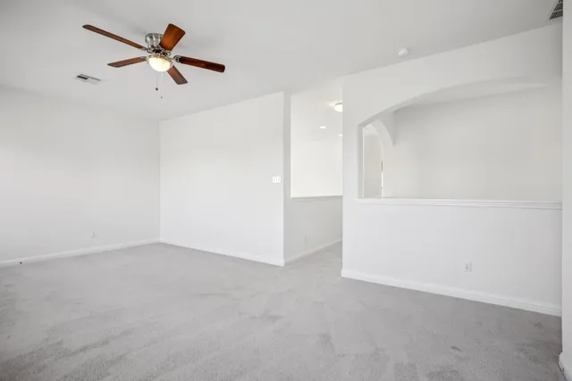 a bedroom with a large bed and a couch