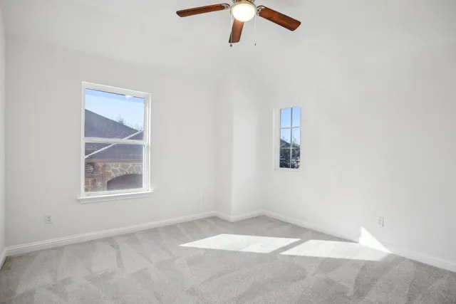 a view of a patio with table and chairs with wooden floor and fence