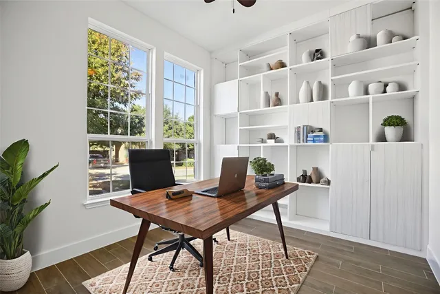 a view of a workspace with furniture and a potted plant