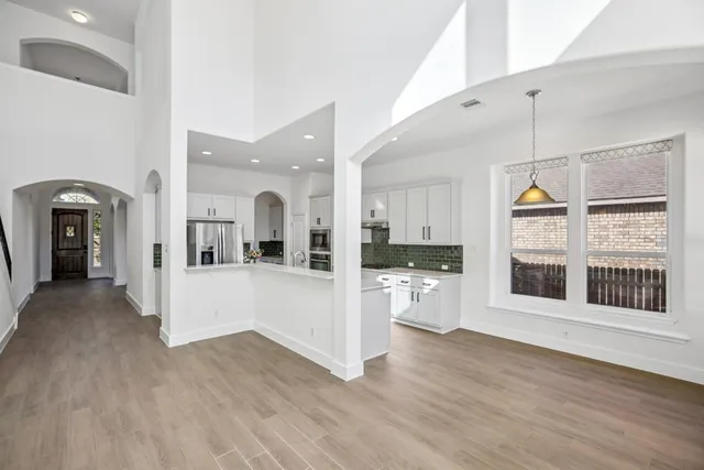 a view of a living room and kitchen view