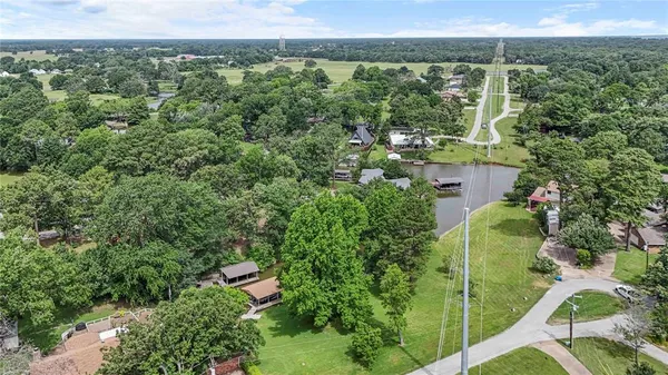 an aerial view of residential building and lake