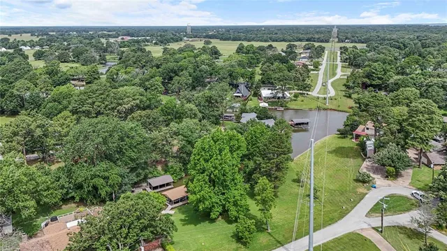 an aerial view of residential building and lake