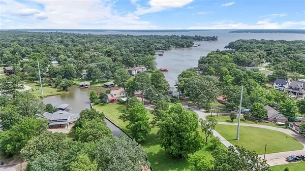 an aerial view of a houses with yard