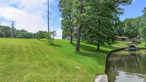 a view of a lake with a yard