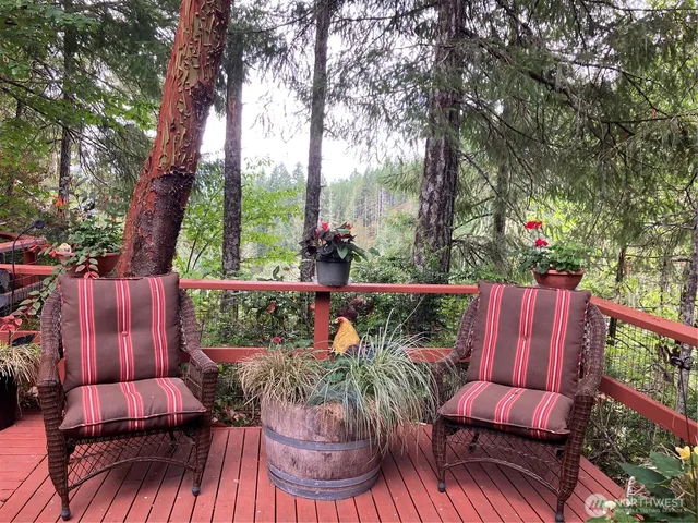 a view of a chairs and table in the patio