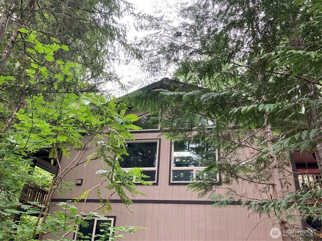 an aerial view of house with yard