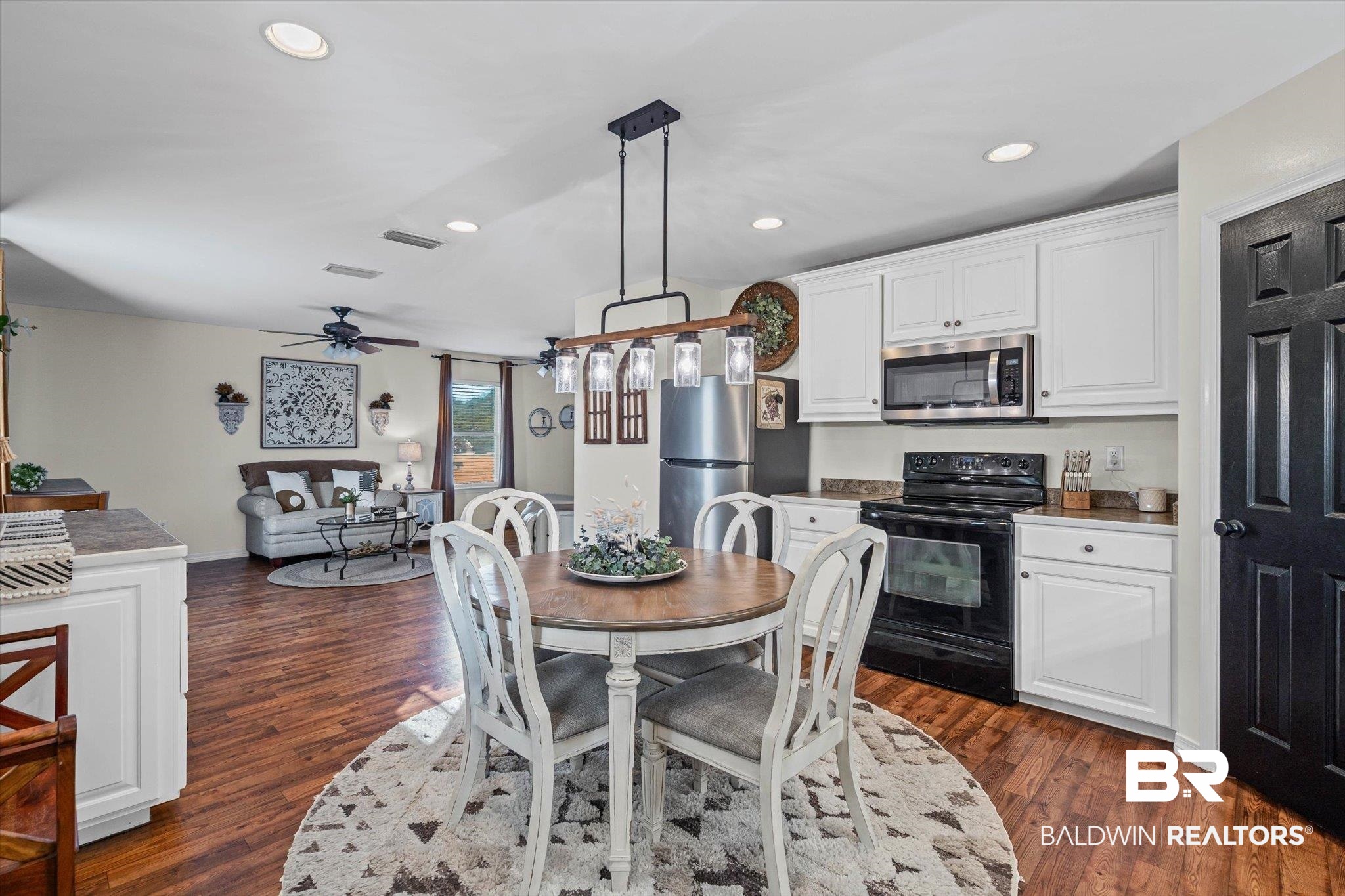 4567 Pine Avenue Saraland, AL 36571 - Photo 24 of 48 Dining space with recessed lighting and dark wood-style flooring